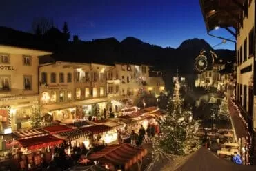 Christmas market in Gruyères, Switzerland, one of the most beautiful christmas markets in the country, set in an enchanting historical setting.