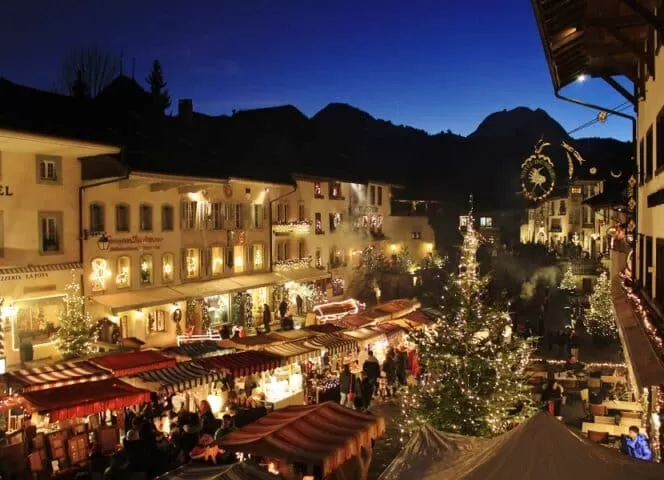 Christmas market in Gruyères, Switzerland, one of the most beautiful christmas markets in the country, set in an enchanting historical setting.